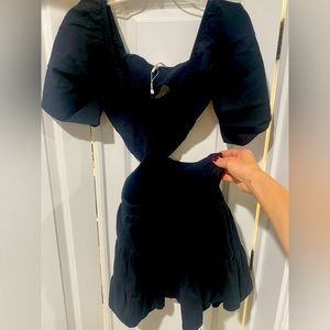 Black square neck smocked chest and cut out dress. Never worn